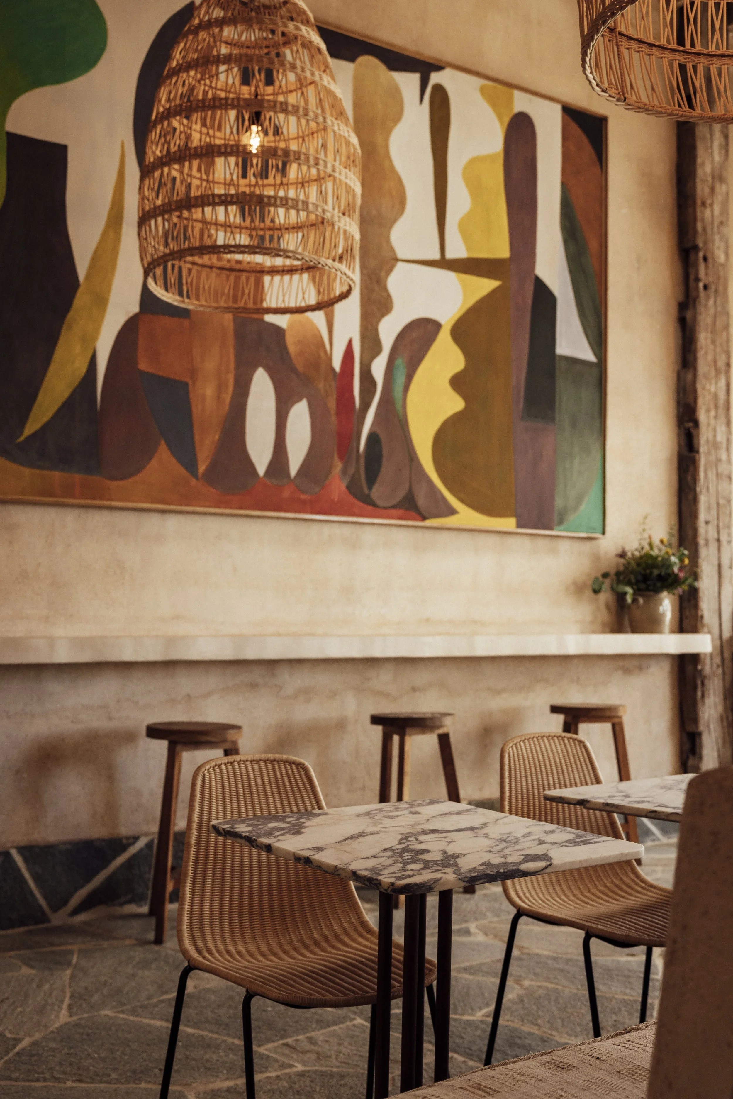Bright dining room with a large abstract mural at Great White Larchmont