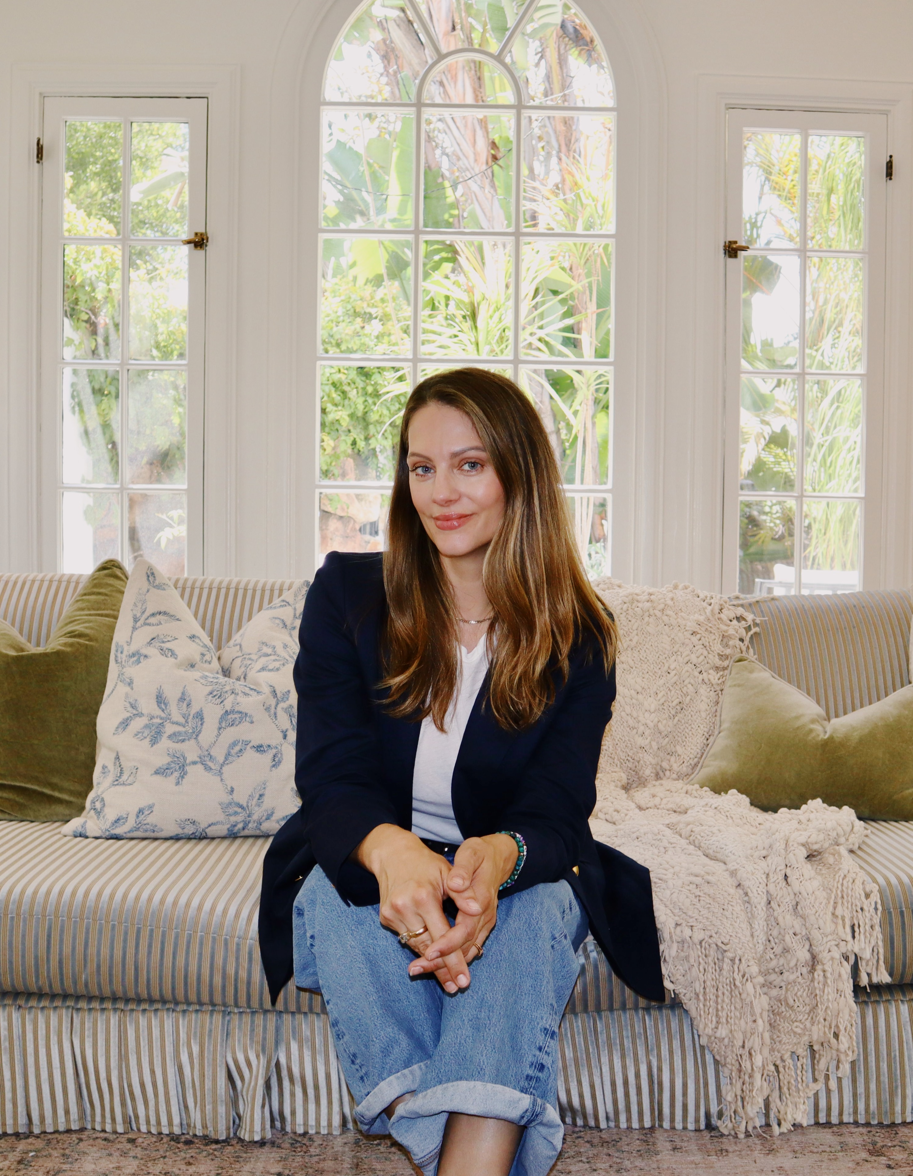 Julia Zonshine seated beside a sunlit window