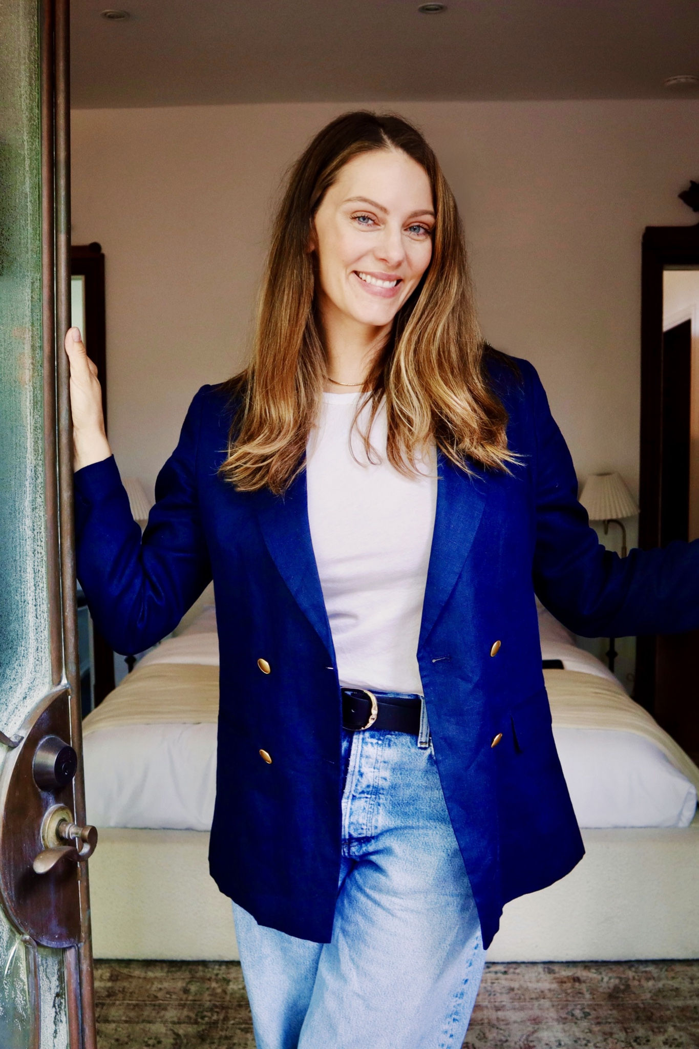 Julia Zonshine smiling in the doorway of a Los Angeles home