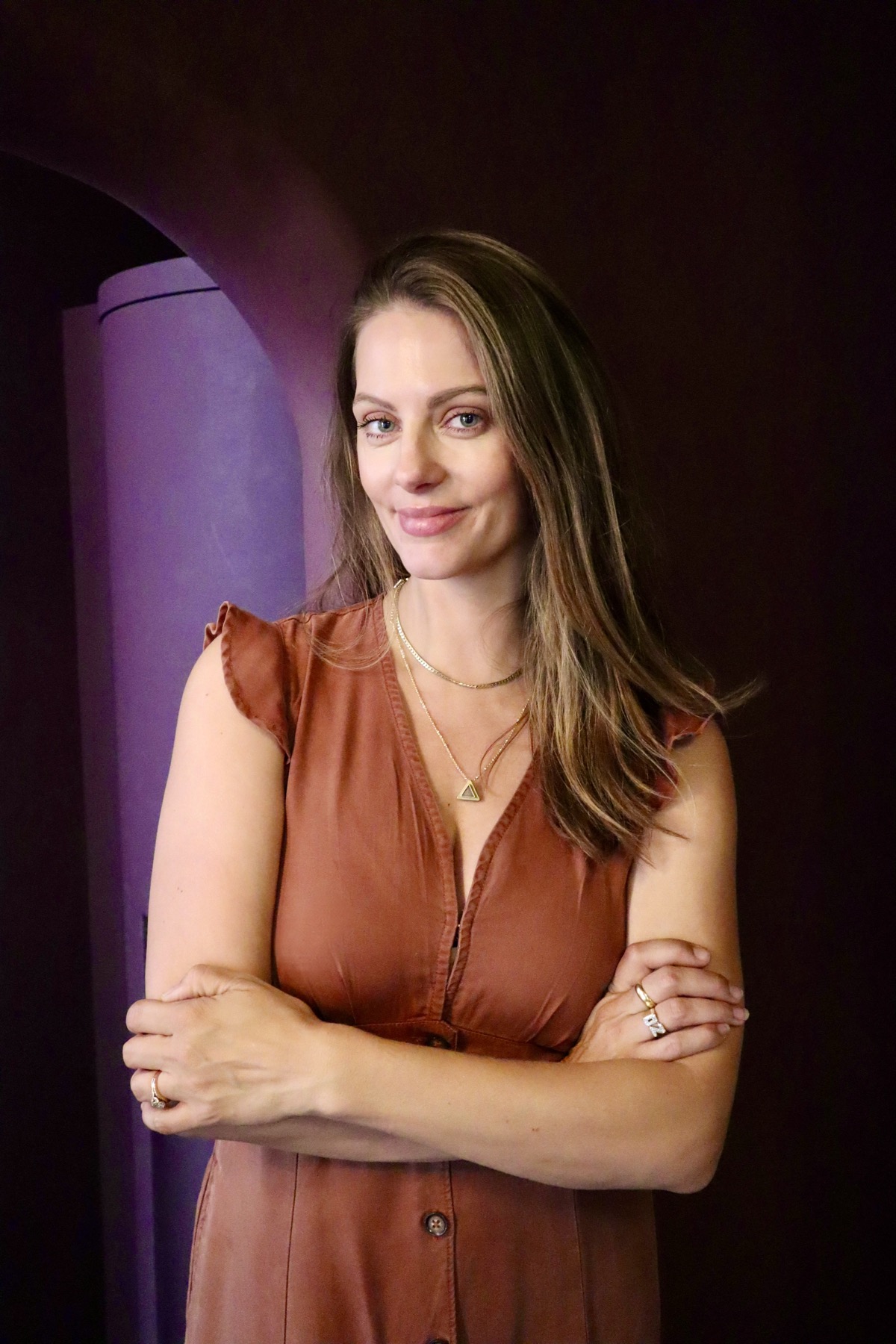 Julia Zonshine standing in front of a purple archway
