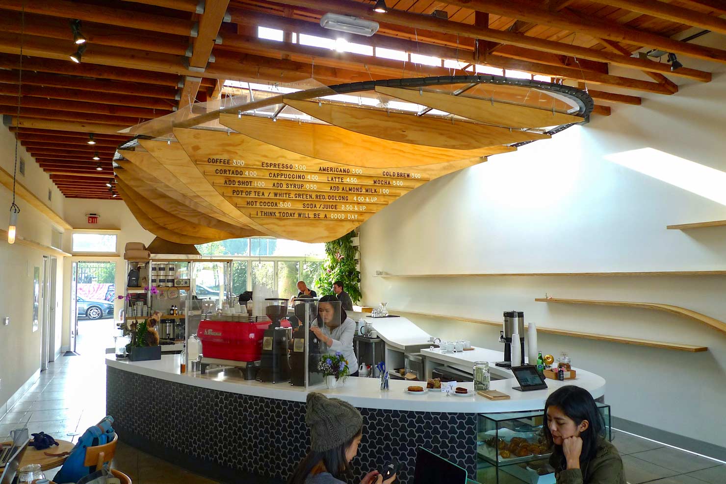 The wood-lined coffee bar at Dinosaur Coffee