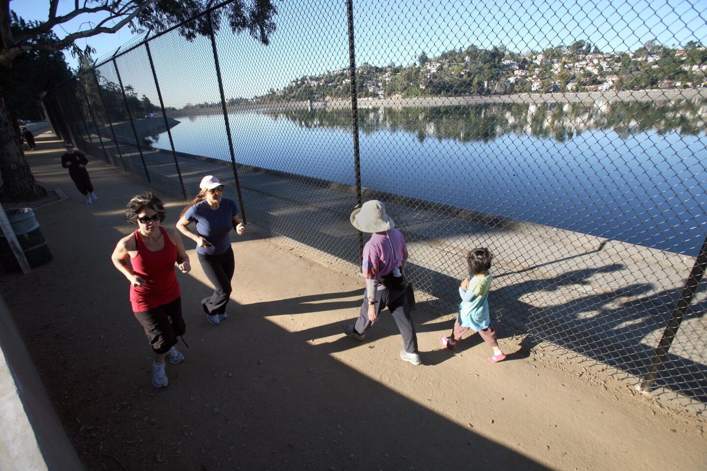 Runners and walkers sharing the path beside Silver Lake Reservoir