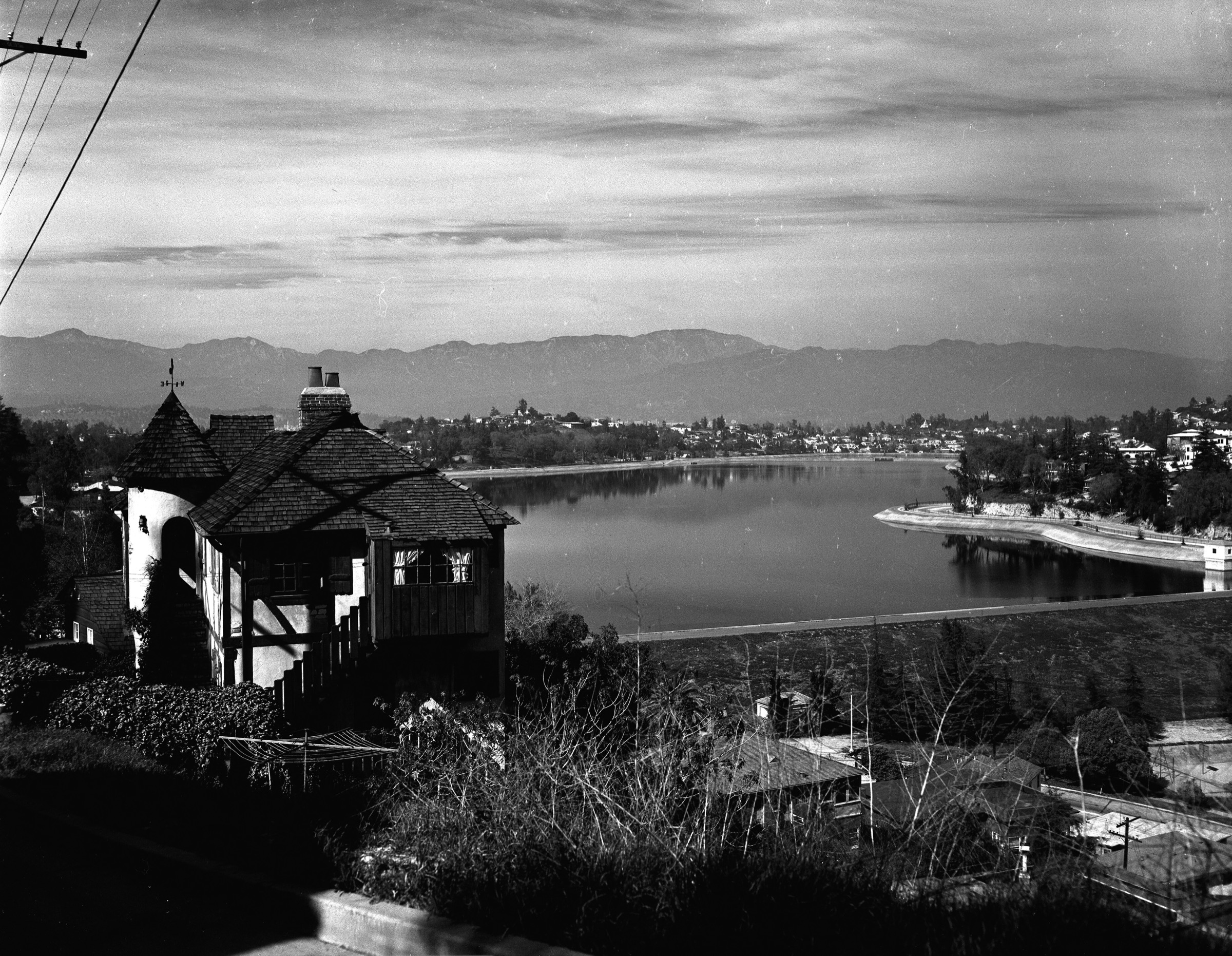 Historic black-and-white view of Silver Lake Reservoir and the surrounding hills