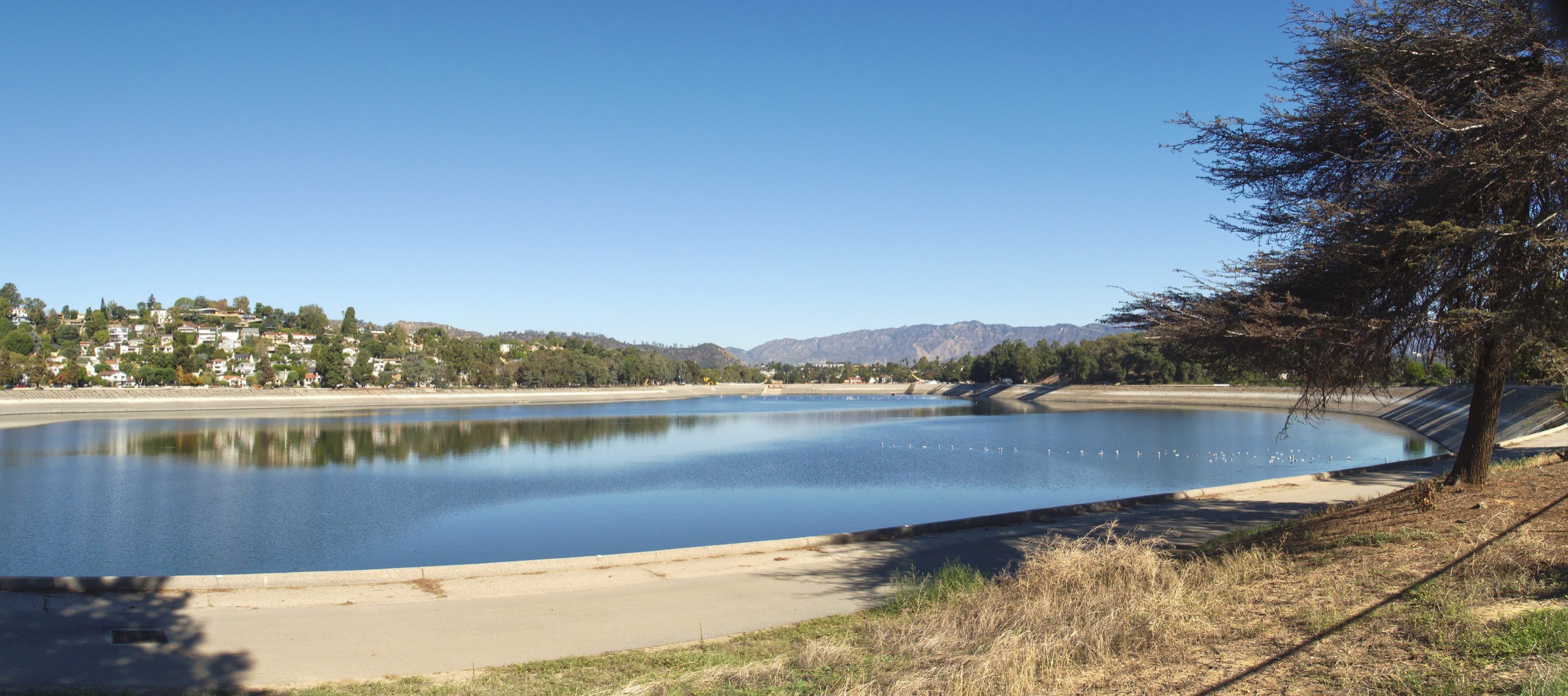 Silver Lake Reservoir, the neighborhood hills, and the San Gabriel Mountains