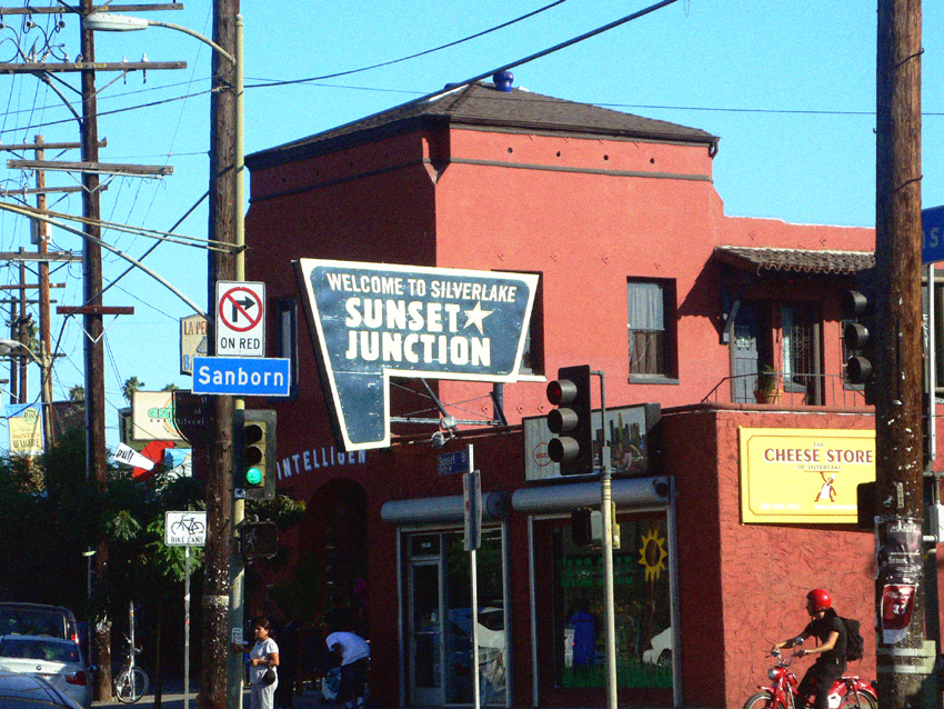 The Welcome to Silverlake Sunset Junction sign above Sunset Boulevard