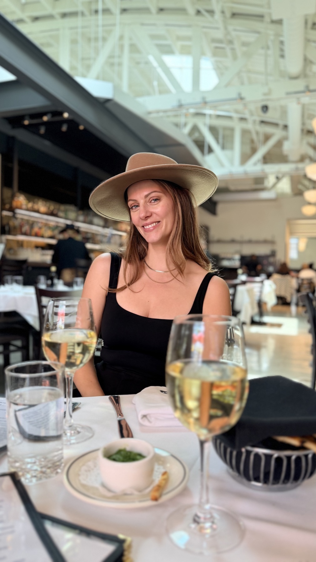 Julia seated at a table at Tre Lune