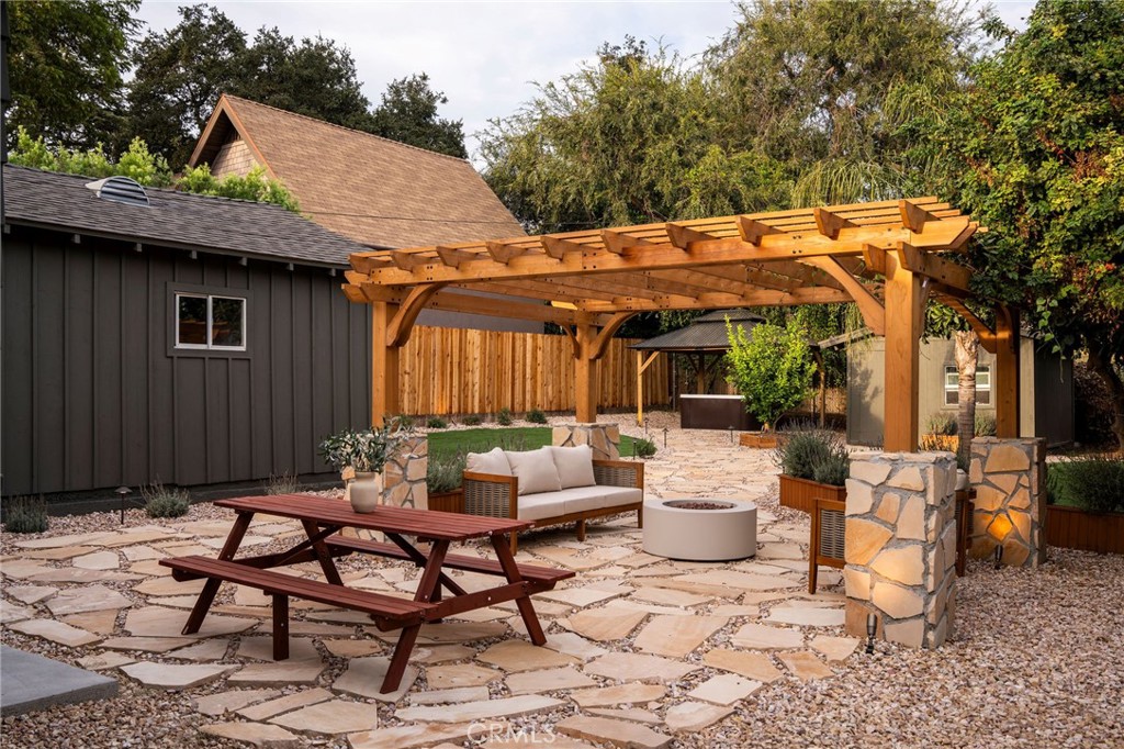 Backyard pergola, fire pit, and garden at 1190 N Wilson Avenue
