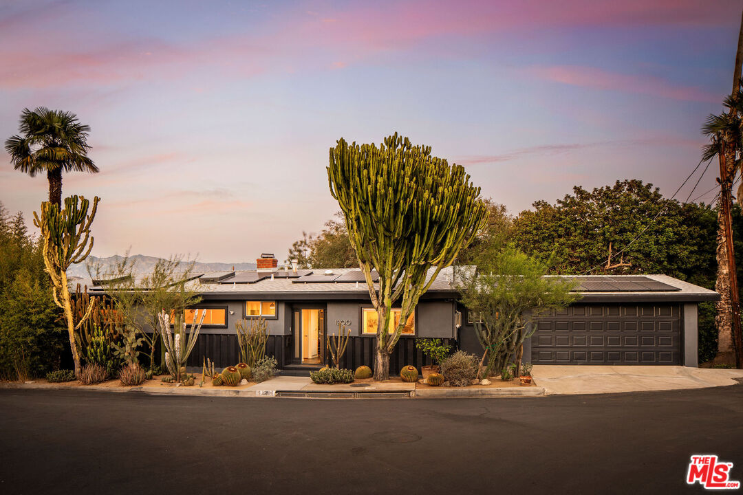 Twilight exterior and cacti at 1200 Olancha Drive