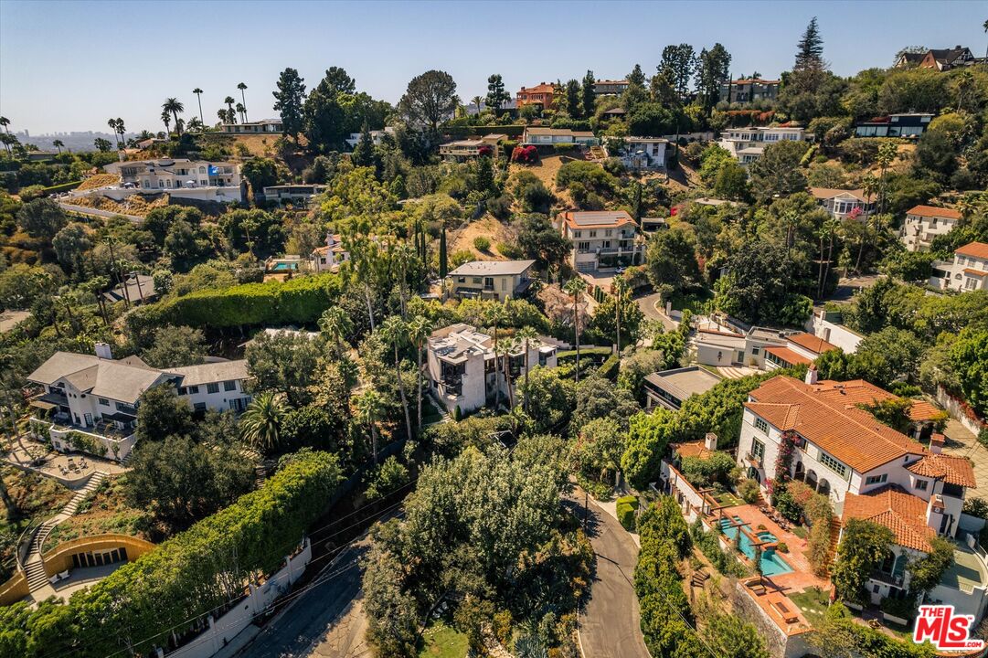 Glass-walled hillside home at 2165 Ponet Drive in Los Feliz