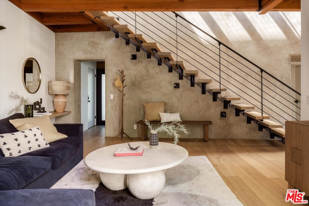 Floating wood and black-steel staircase at 2165 Ponet Drive