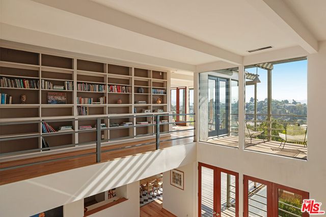 Loft library and glass walls overlooking the Silver Lake Reservoir
