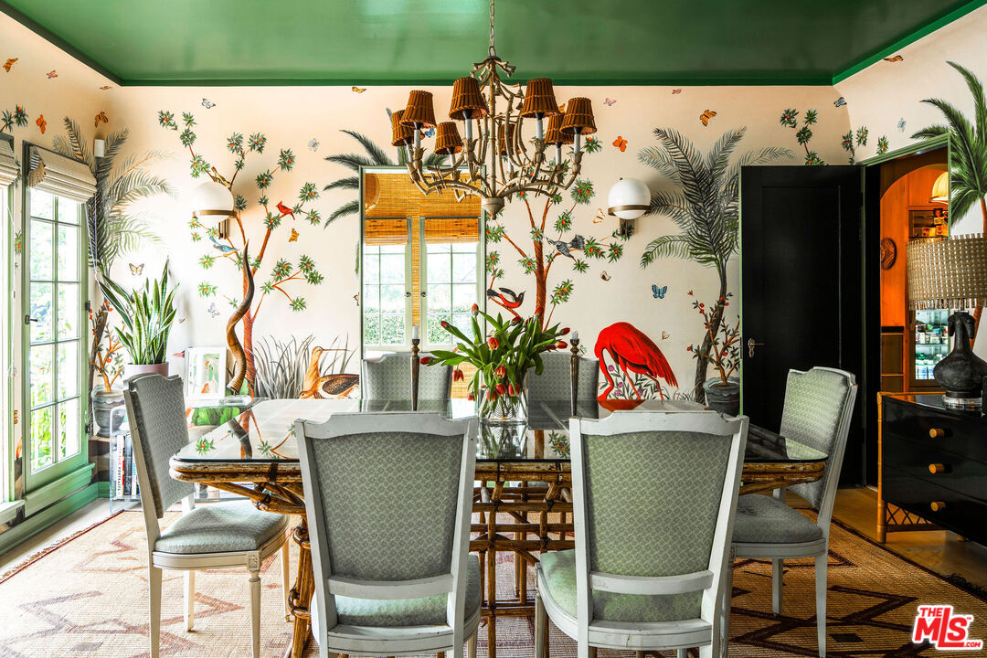 Dining room wrapped in hand-painted botanical wallpaper at 2351 Canyon Drive