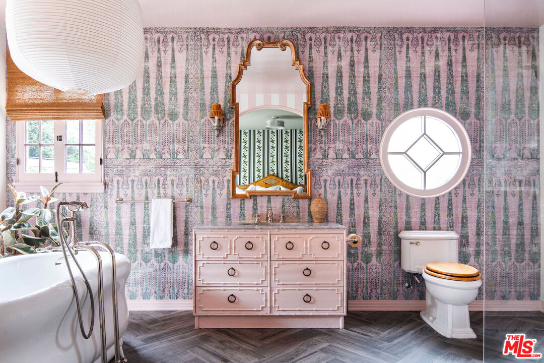 Pink bathroom with a freestanding soaking tub at 2351 Canyon Drive