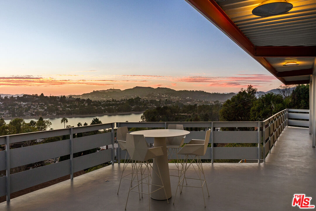 Rooftop deck at dusk overlooking the Silver Lake reservoir and hills from 2383 Loma Vista Pl