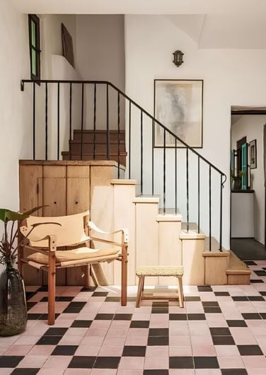 Checkerboard tile and original details at the staircase