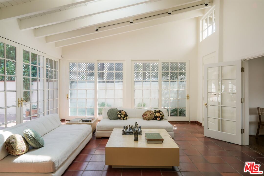 Vaulted skylit sunroom at 2560 Micheltorena Street
