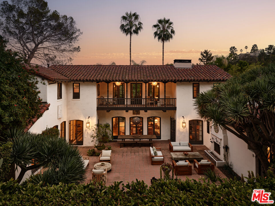 Spanish Colonial Revival courtyard at 2666 Aberdeen Avenue at sunset