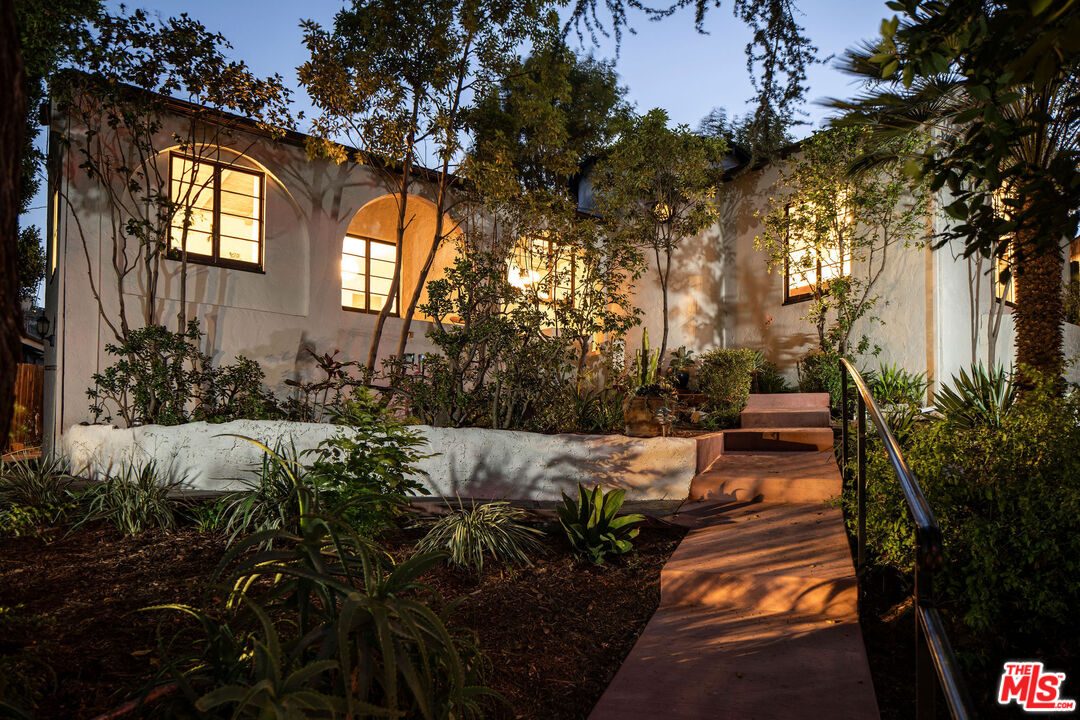 Garden path leading to the 1929 Spanish cottage at 3895 Fredonia Drive