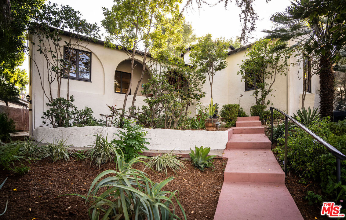 Daytime view of the cottage and landscaped front garden