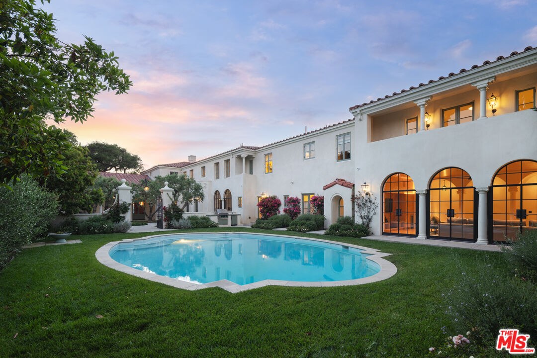 Dusk exterior and pool at 402 S Las Palmas Ave in Hancock Park