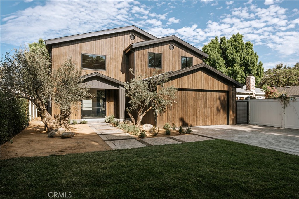 Wood-clad exterior and landscaped front yard at 5114 Cedros Avenue
