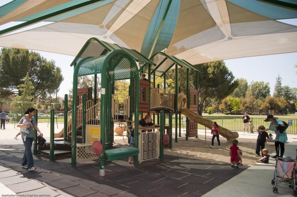 Shade structure and open lawn at Warner Park in Woodland Hills
